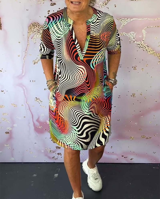 Women's V-Neck Dress with Colorful Print and Flowy Design